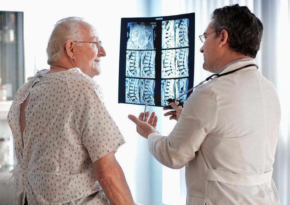 doctor with patient explaining spinal scan